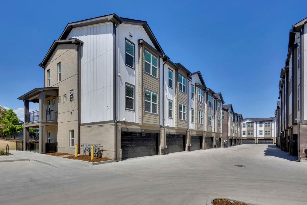 Alley view of townhome garages